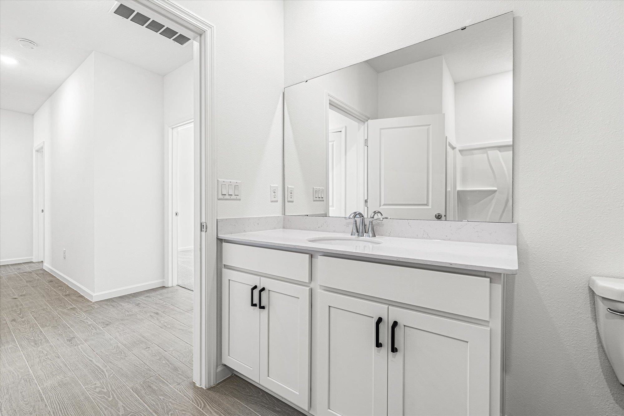89 Kingsley Pk Way St. Augustine, FL 32084 - Photo 28 of 67 a bathroom with a sink and a mirror