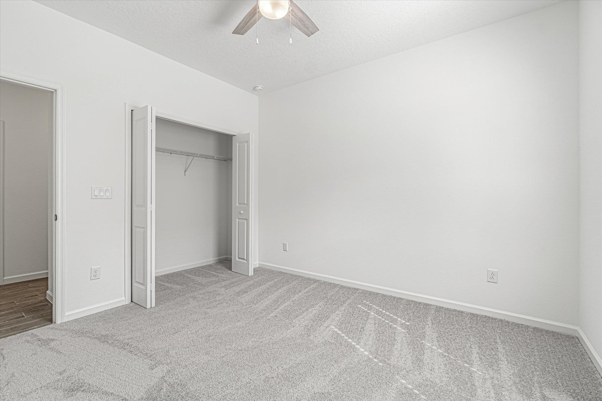 89 Kingsley Pk Way St. Augustine, FL 32084 - Photo 30 of 67 an empty room with a ceiling fan and a window