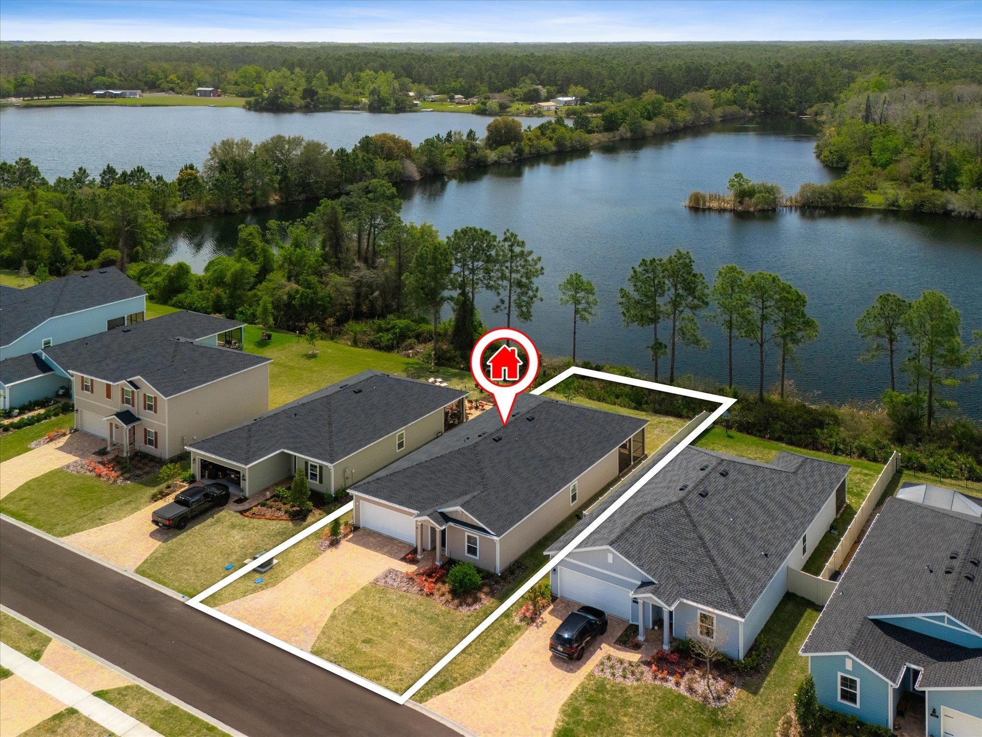 89 Kingsley Pk Way St. Augustine, FL 32084 - Photo 46 of 67 an aerial view of a house with pool and lake view