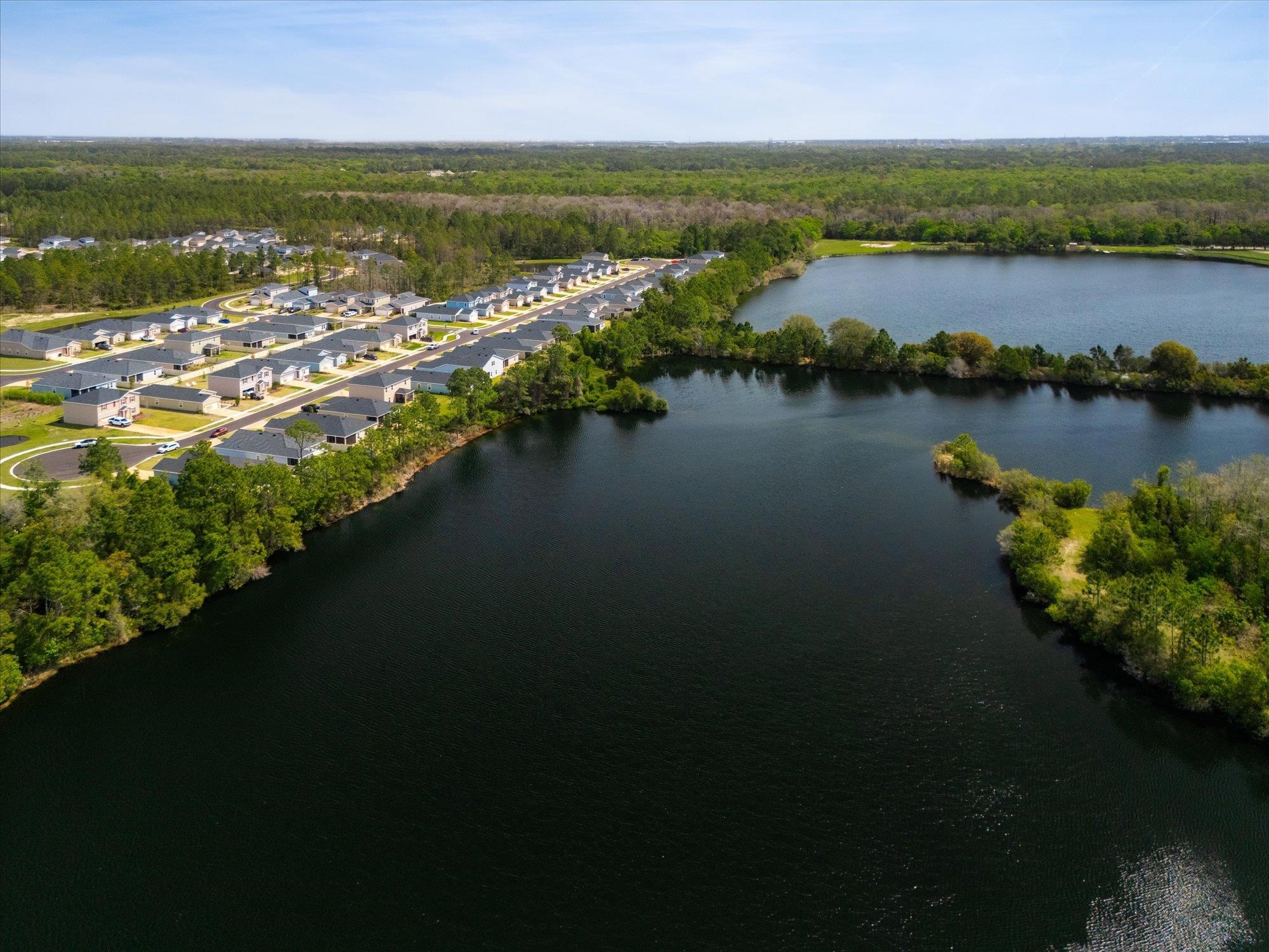 89 Kingsley Pk Way St. Augustine, FL 32084 - Photo 49 of 67 an aerial view of residential houses with outdoor space and lake view