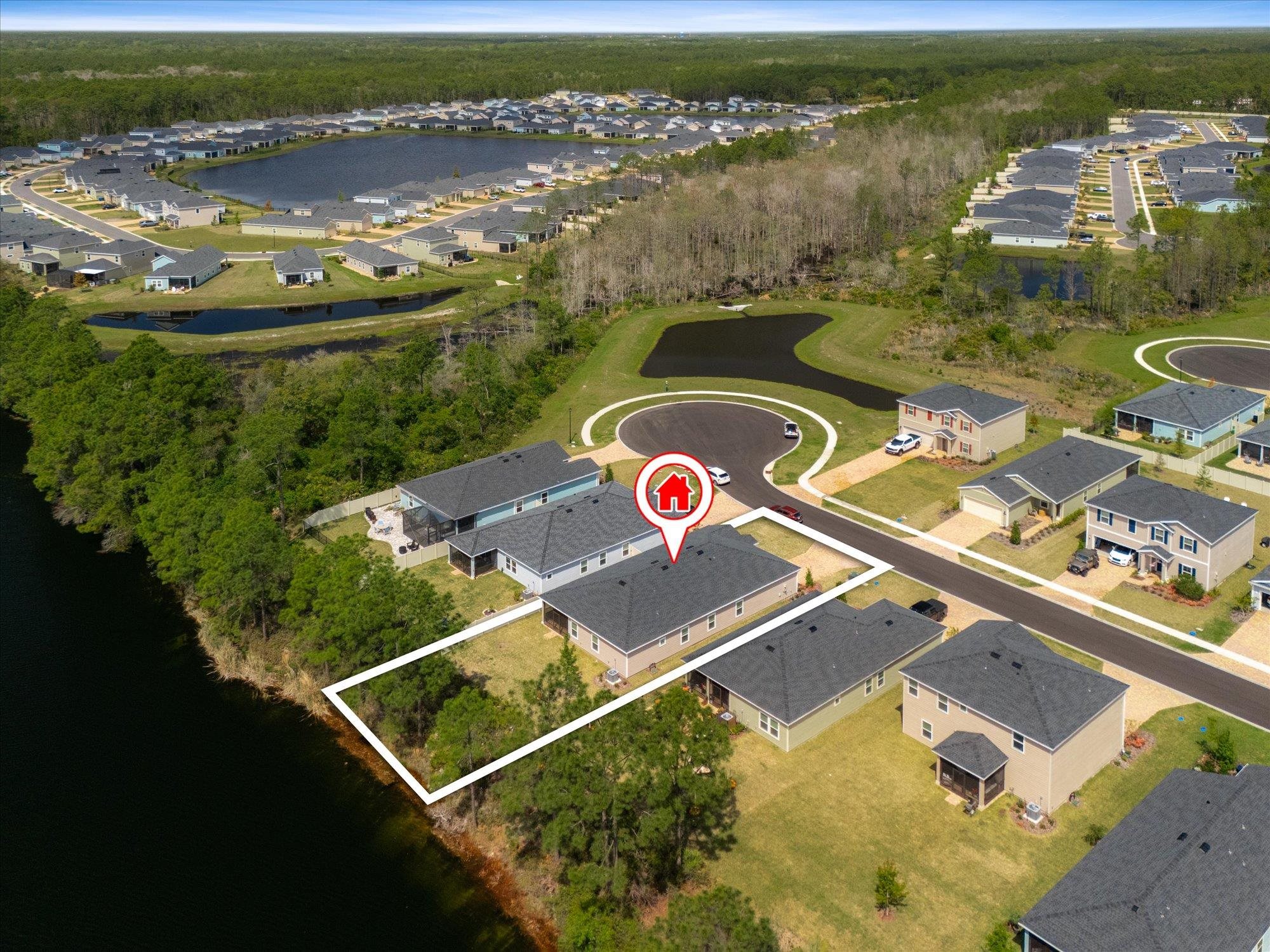 89 Kingsley Pk Way St. Augustine, FL 32084 - Photo 57 of 67 an aerial view of a house with a swimming pool