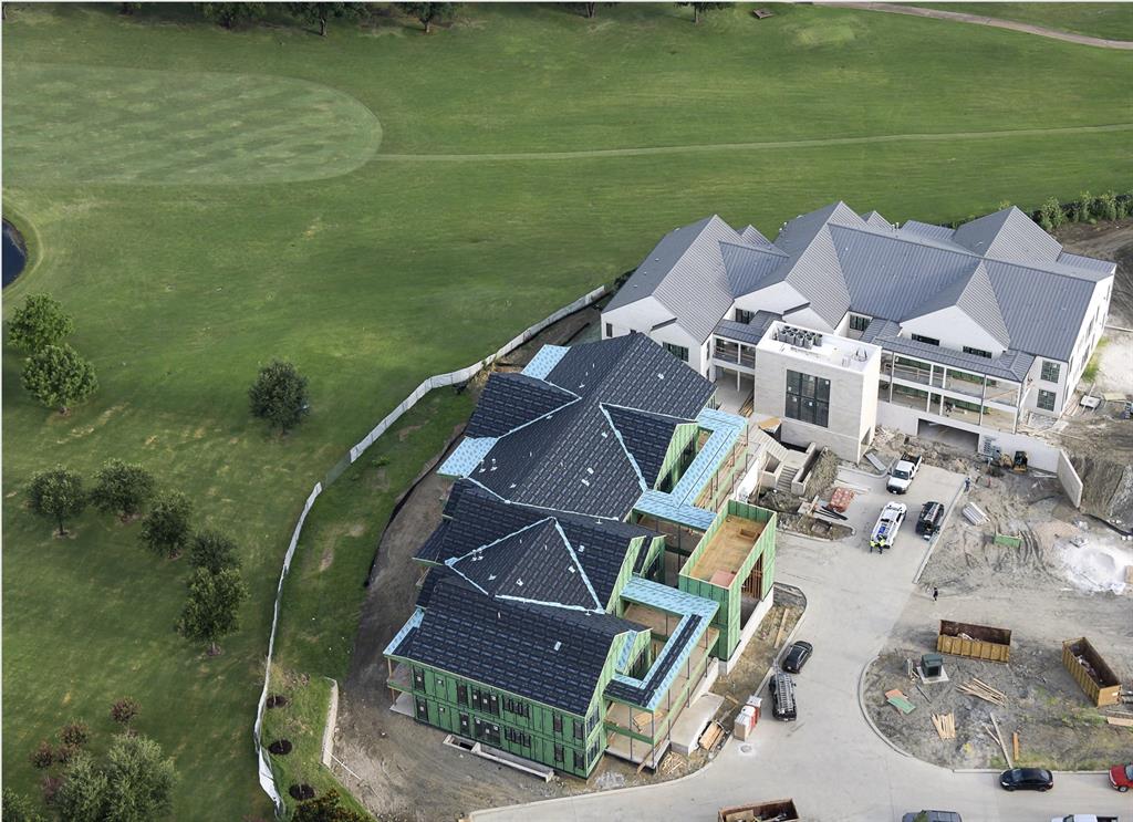 350 North O Connor Ridge Boulevard, Unit 21 Irving, TX 75038 - Photo 2 of 36 Villa Seven views toward the waterfall and 18th fairway