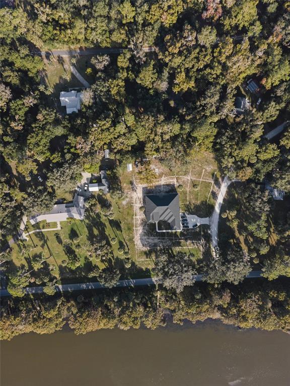 6809 Southeast 14th Lane Gainesville, FL 32641 - Photo 3 of 14 a view of a backyard of a house with a tree