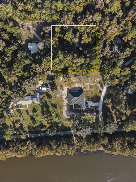 6809 Southeast 14th Lane Gainesville, FL 32641 - Photo 4 of 14 a backyard of a house with table and chairs