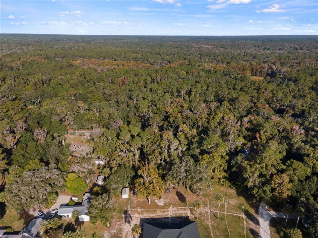 6809 Southeast 14th Lane Gainesville, FL 32641 - Photo 9 of 14 an aerial view of residential houses with outdoor space