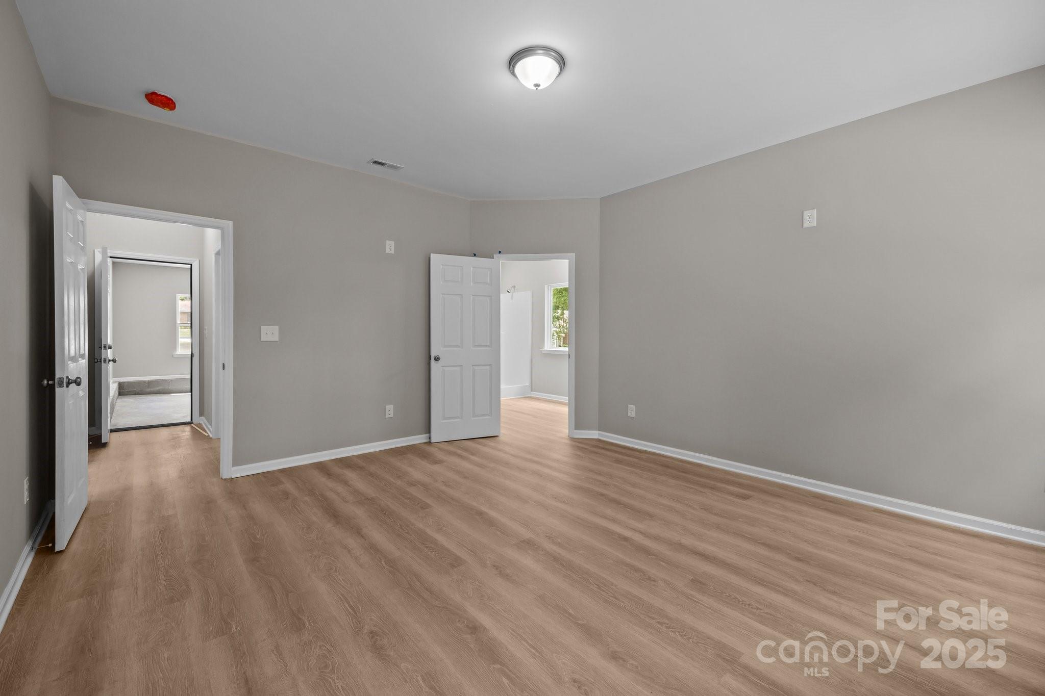 126 Aurora Boulevard Matthews, NC 28105 - Photo 11 of 41 a view of an empty room with wooden floor