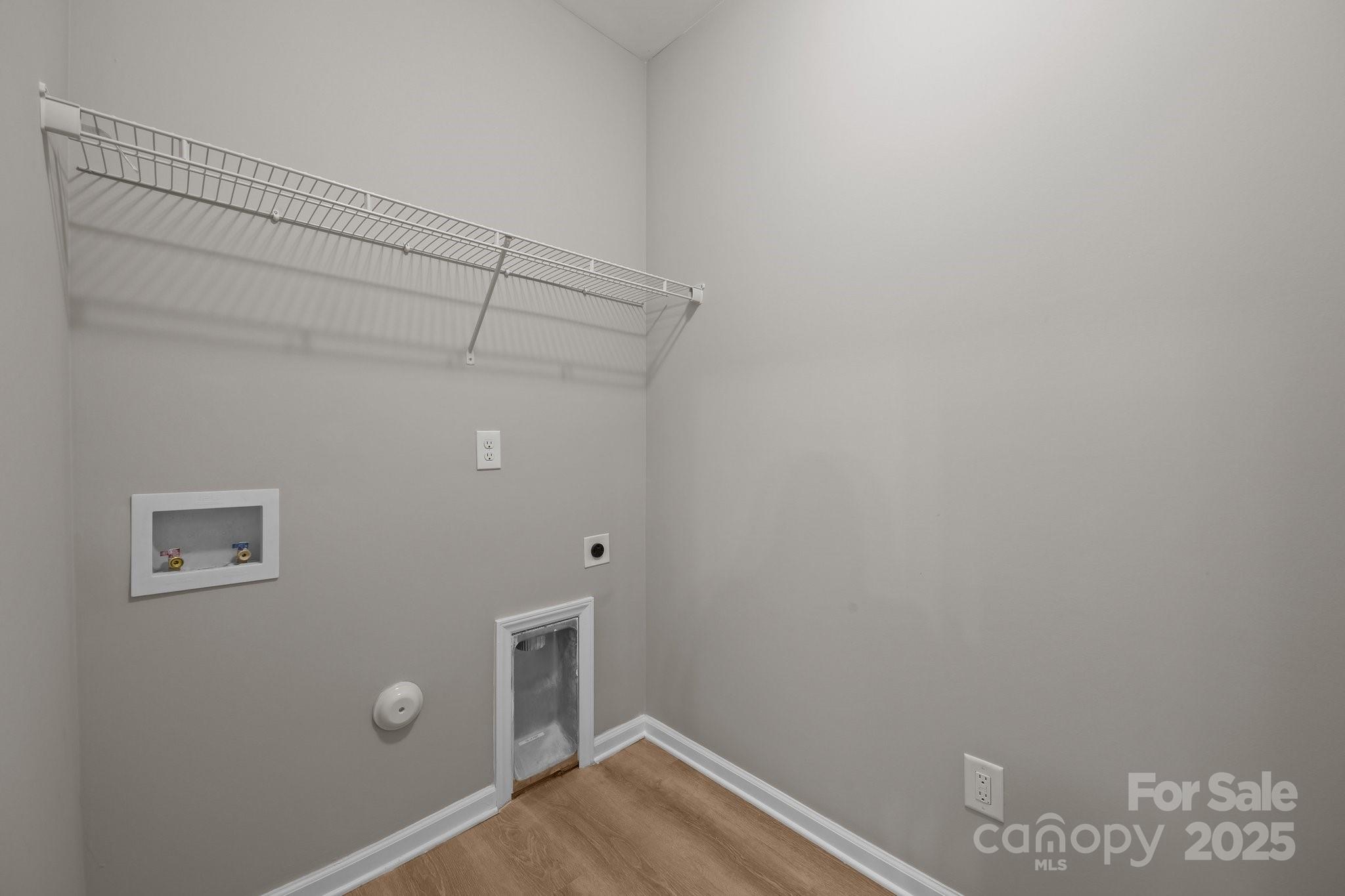 126 Aurora Boulevard Matthews, NC 28105 - Photo 16 of 41 a view of a room with empty racks on the wall