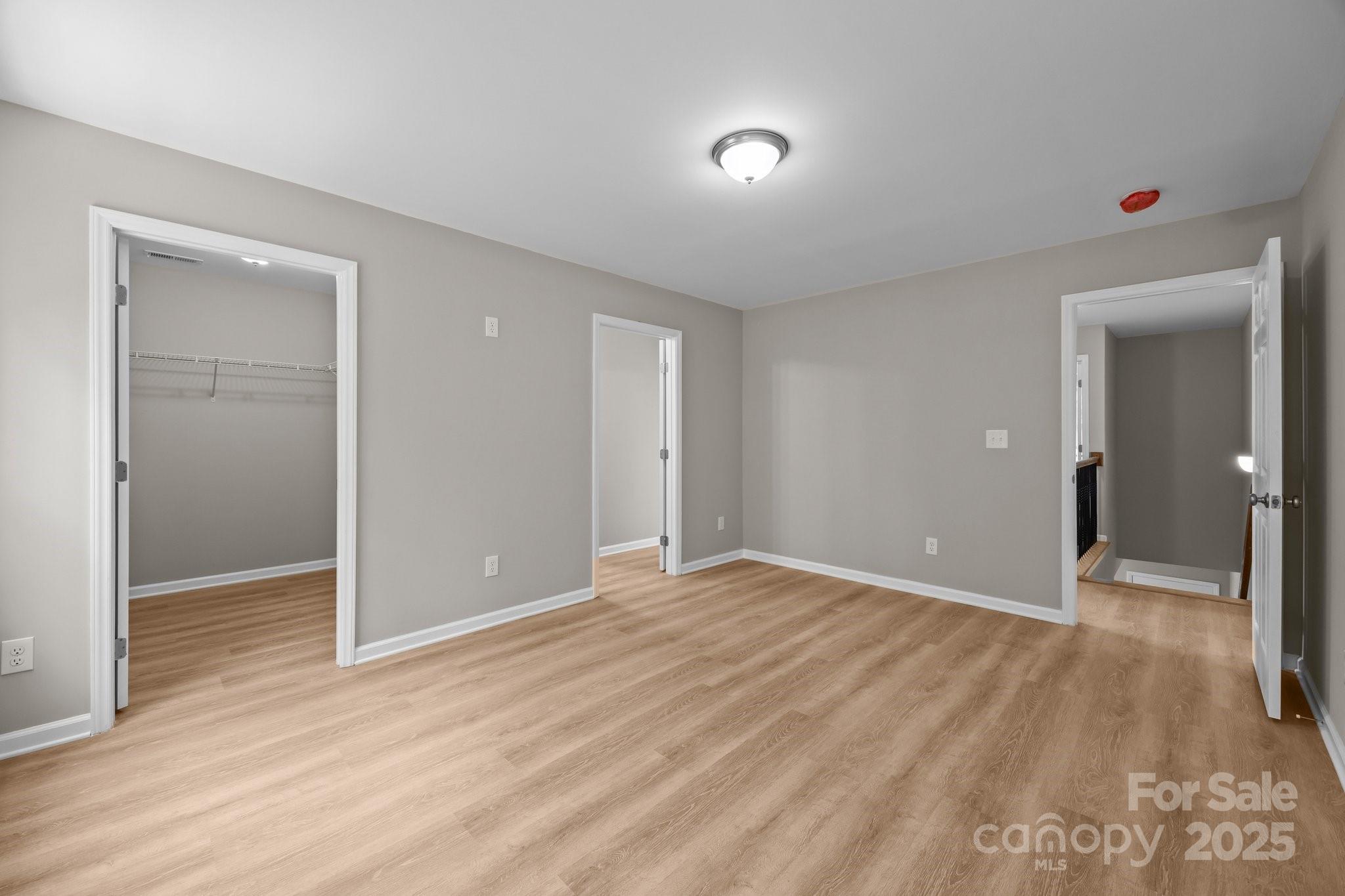 126 Aurora Boulevard Matthews, NC 28105 - Photo 22 of 41 a view of an empty room with wooden floor