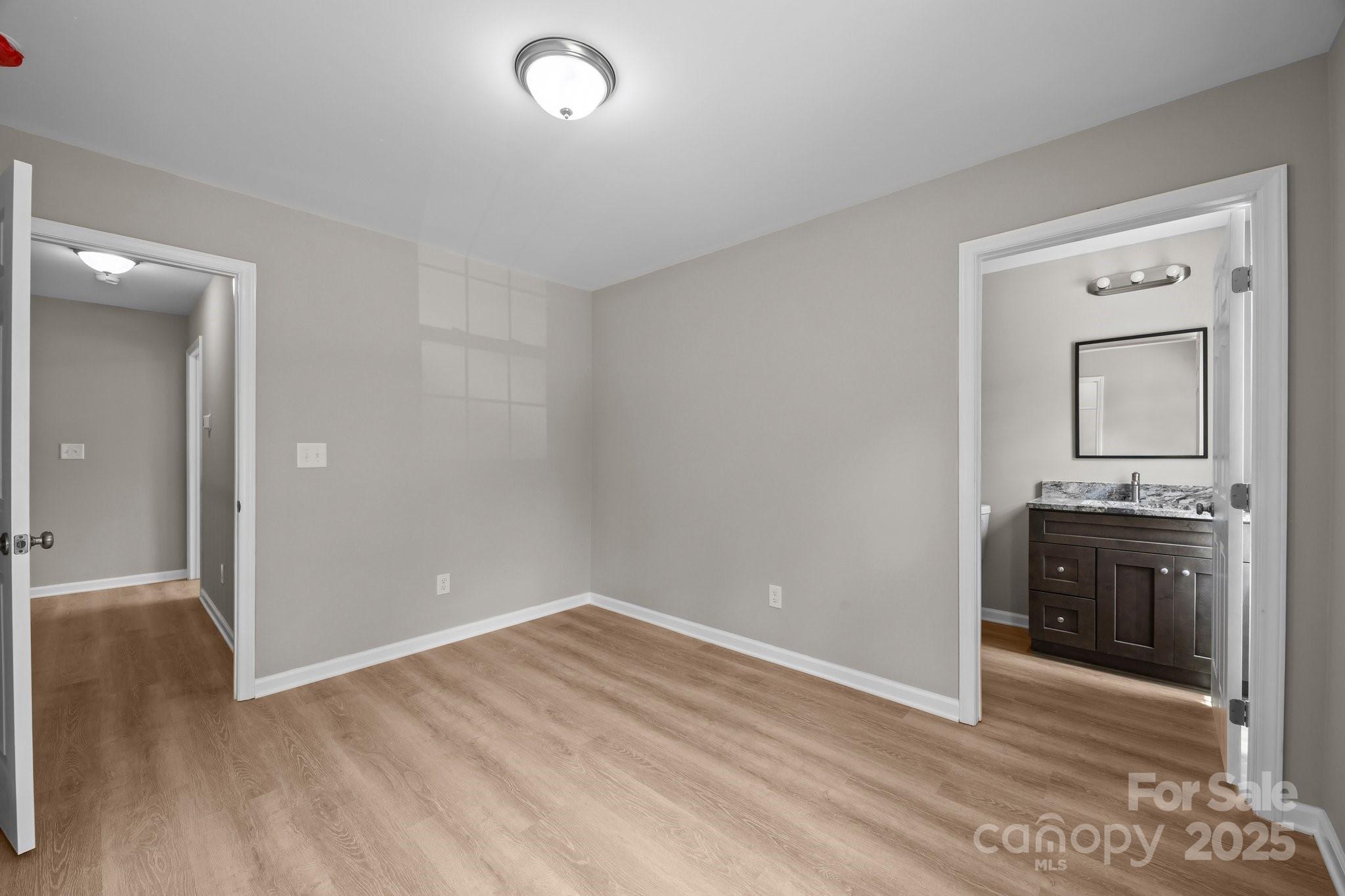 126 Aurora Boulevard Matthews, NC 28105 - Photo 24 of 41 wooden floor in an empty room and a mirror