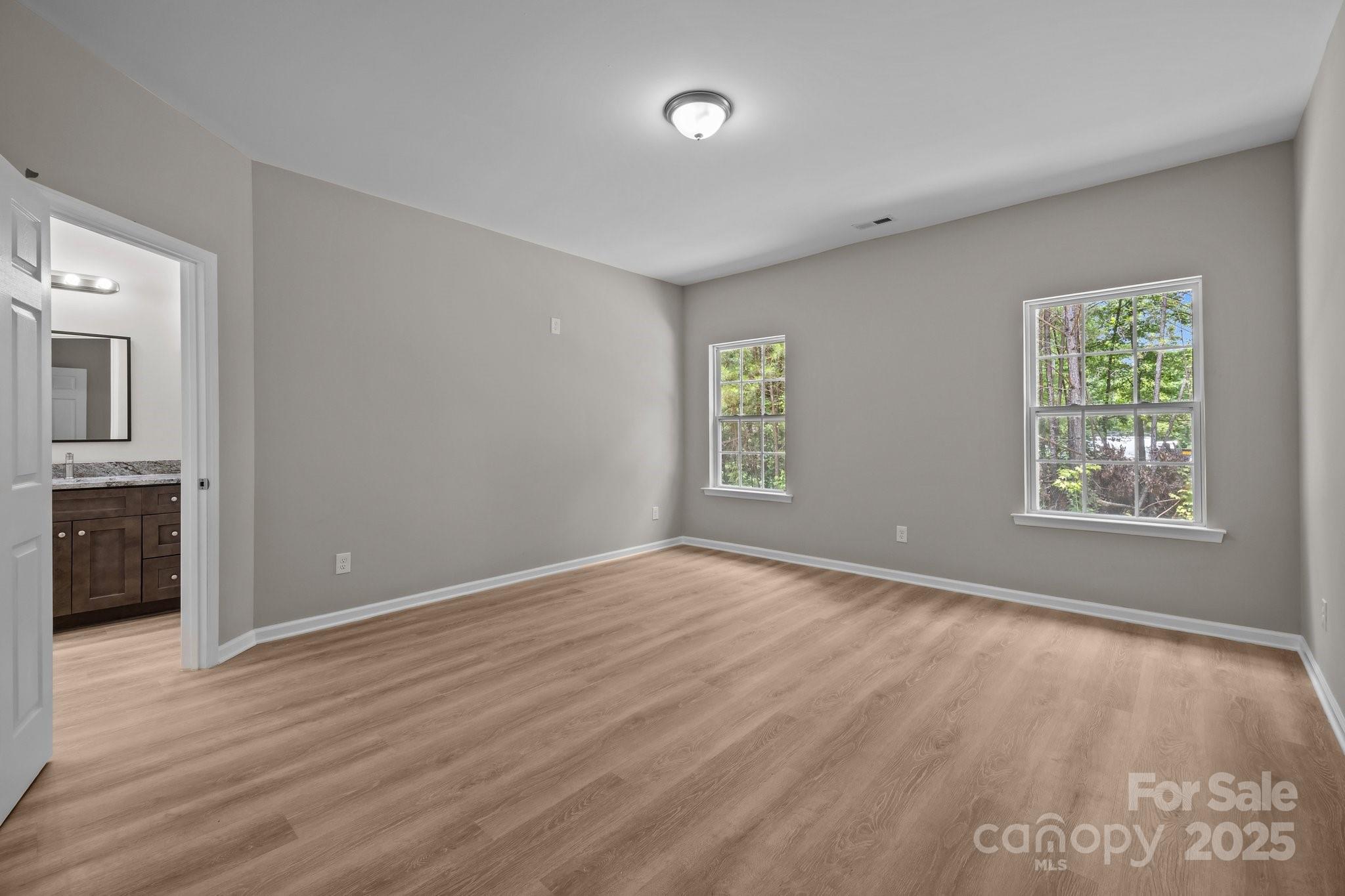 126 Aurora Boulevard Matthews, NC 28105 - Photo 26 of 41 an empty room with windows and closet