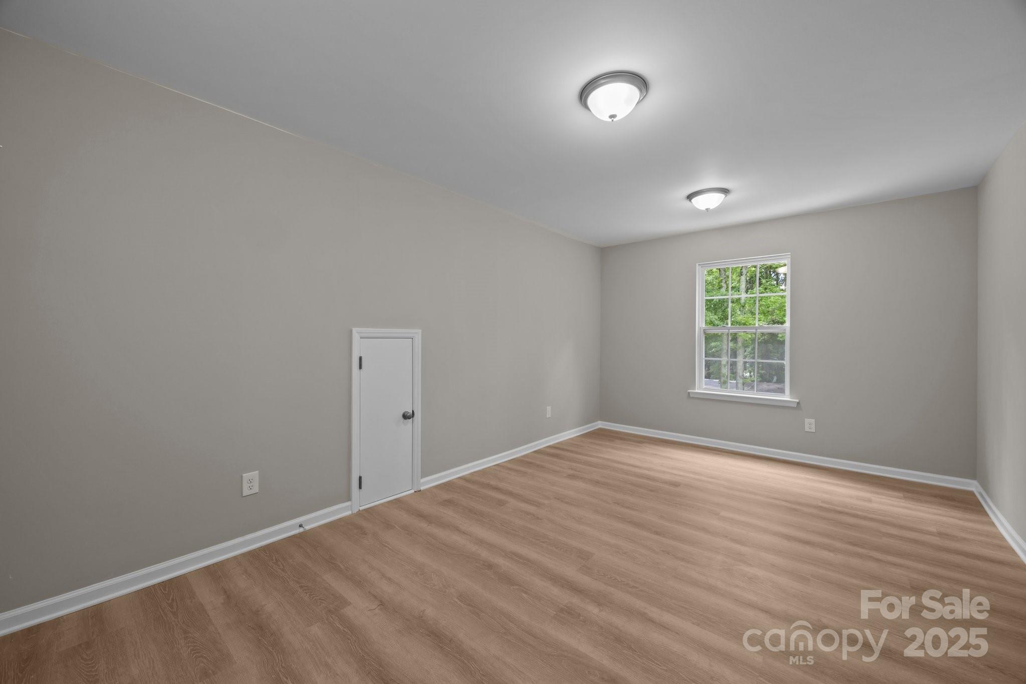 126 Aurora Boulevard Matthews, NC 28105 - Photo 28 of 41 wooden floor in an empty room with a window