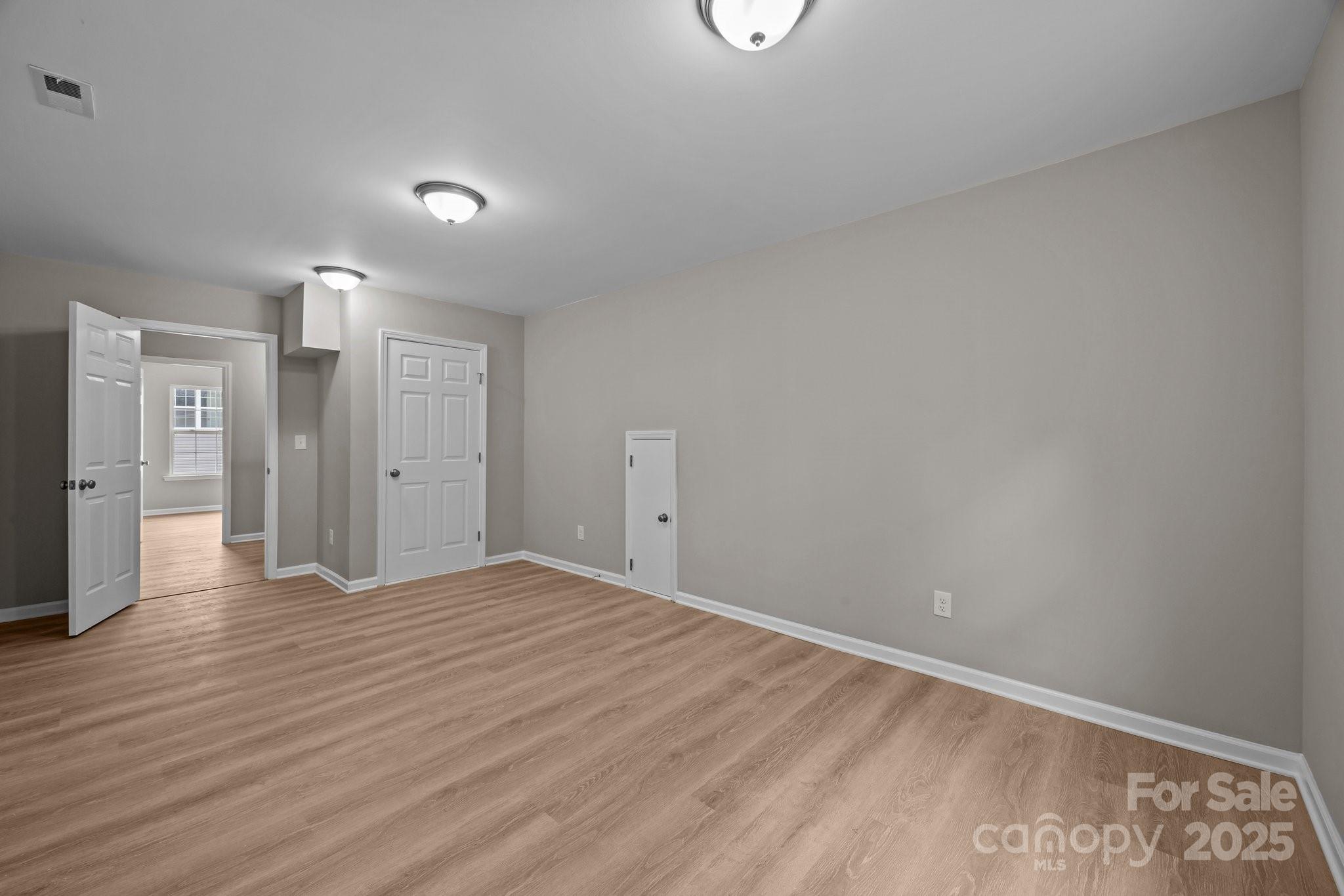 126 Aurora Boulevard Matthews, NC 28105 - Photo 29 of 41 a view of an empty room with wooden floor