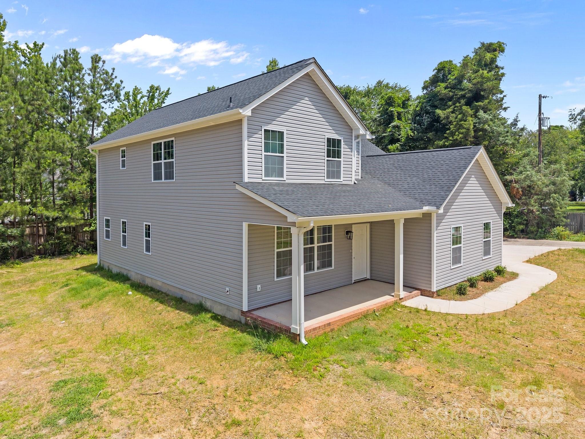 126 Aurora Boulevard Matthews, NC 28105 - Photo 3 of 41 a view of house with backyard and garden