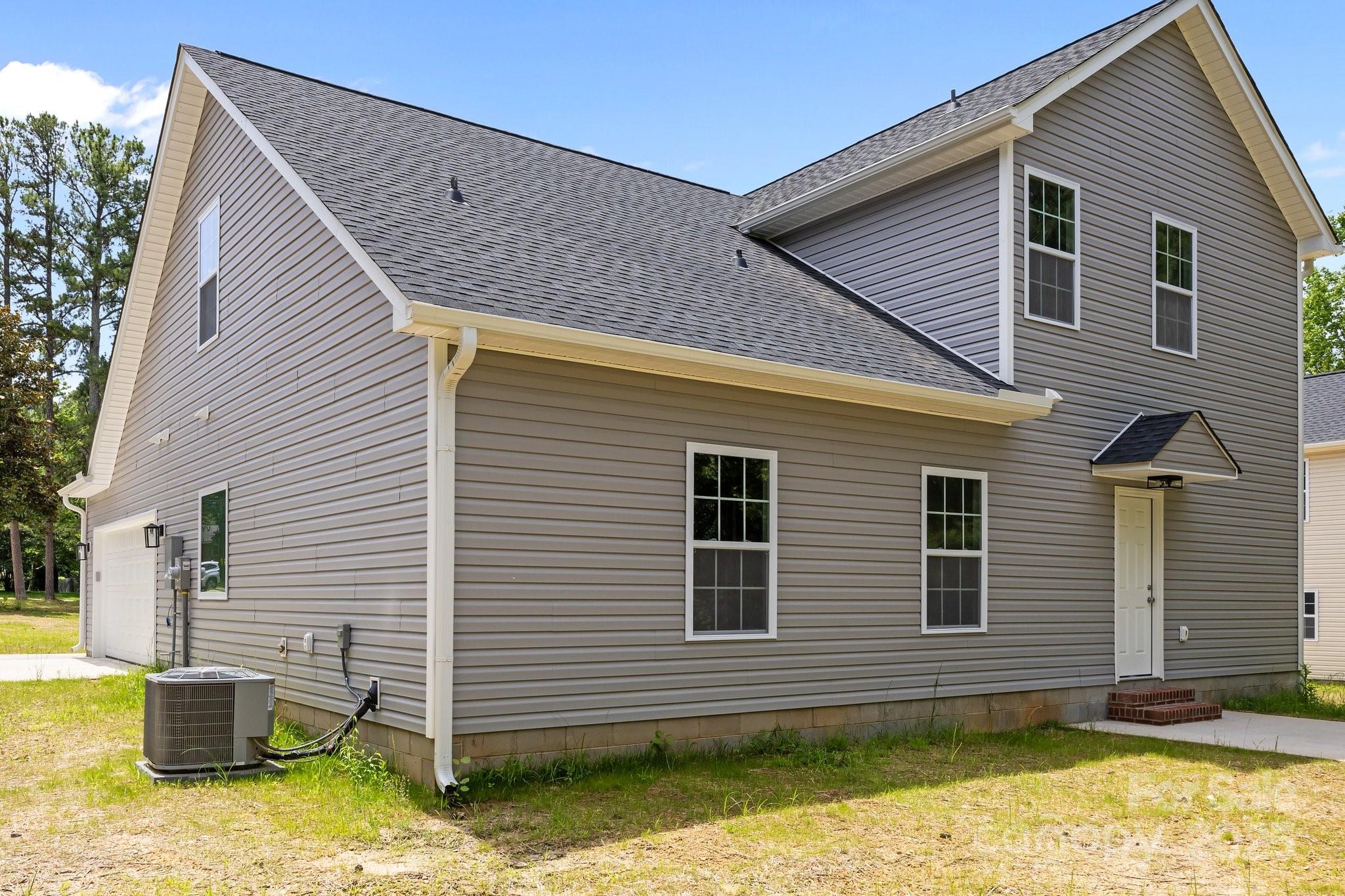 126 Aurora Boulevard Matthews, NC 28105 - Photo 34 of 41 a view of a house with a yard