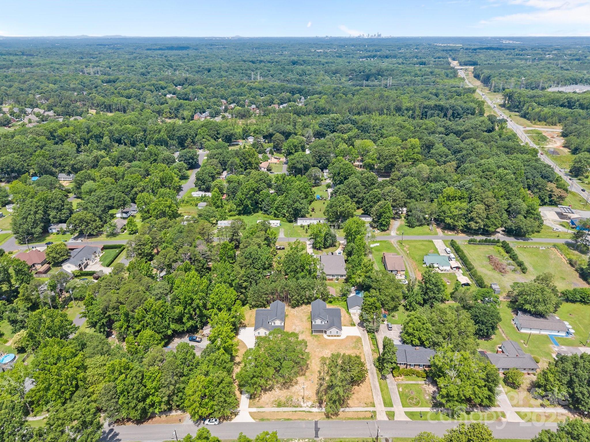 126 Aurora Boulevard Matthews, NC 28105 - Photo 38 of 41 an aerial view of residential houses with outdoor space and trees