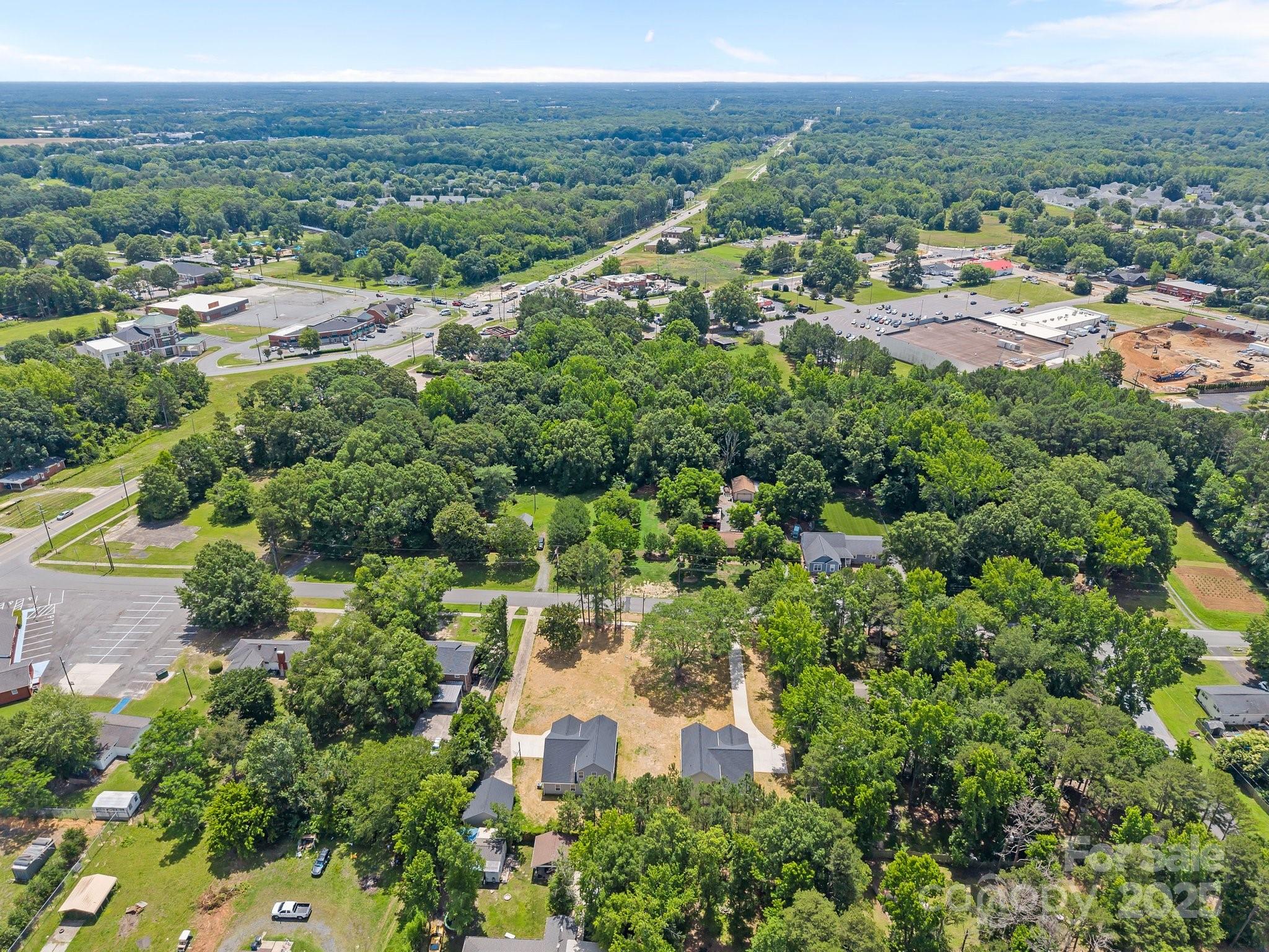 126 Aurora Boulevard Matthews, NC 28105 - Photo 39 of 41 an aerial view of residential houses with outdoor space and trees