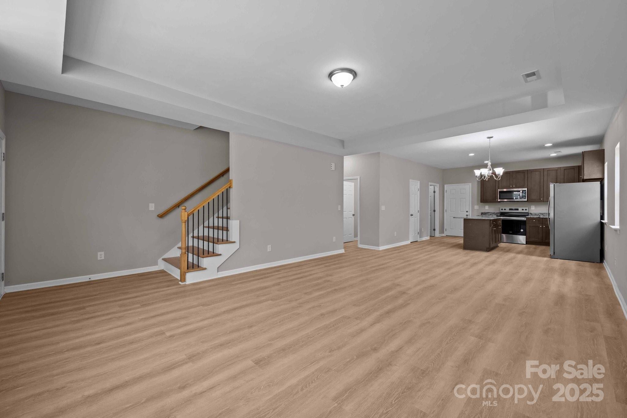 126 Aurora Boulevard Matthews, NC 28105 - Photo 6 of 41 a view of kitchen with a sink and a refrigerator
