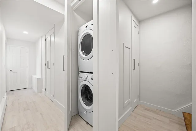 a view of a hallway with washer and dryer
