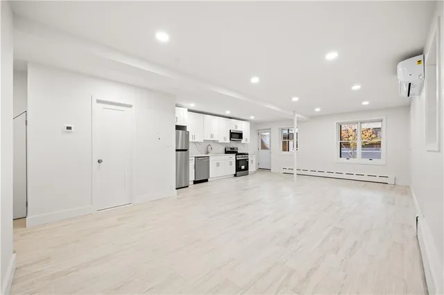 a view of a livingroom with a kitchen