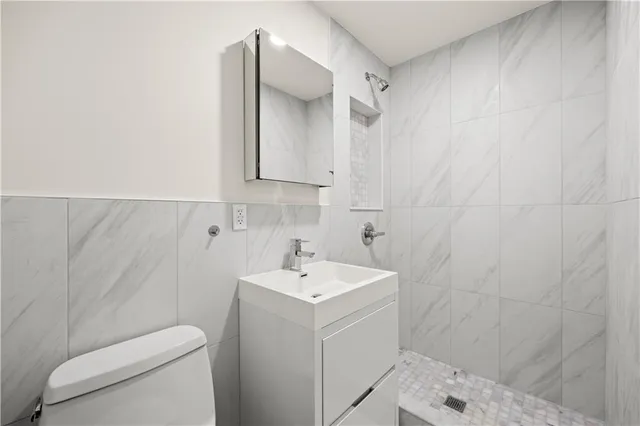 a bathroom with a sink toilet and vanity