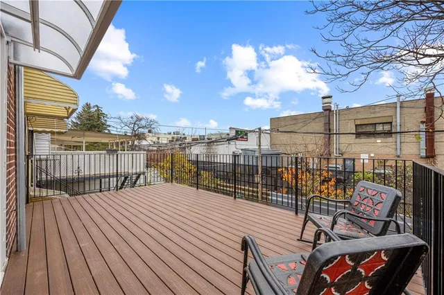 a balcony with wooden floor