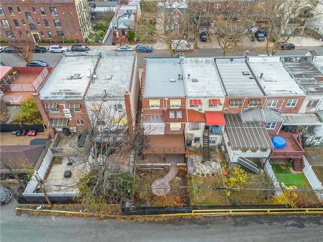 a picture of a bench in front of a building