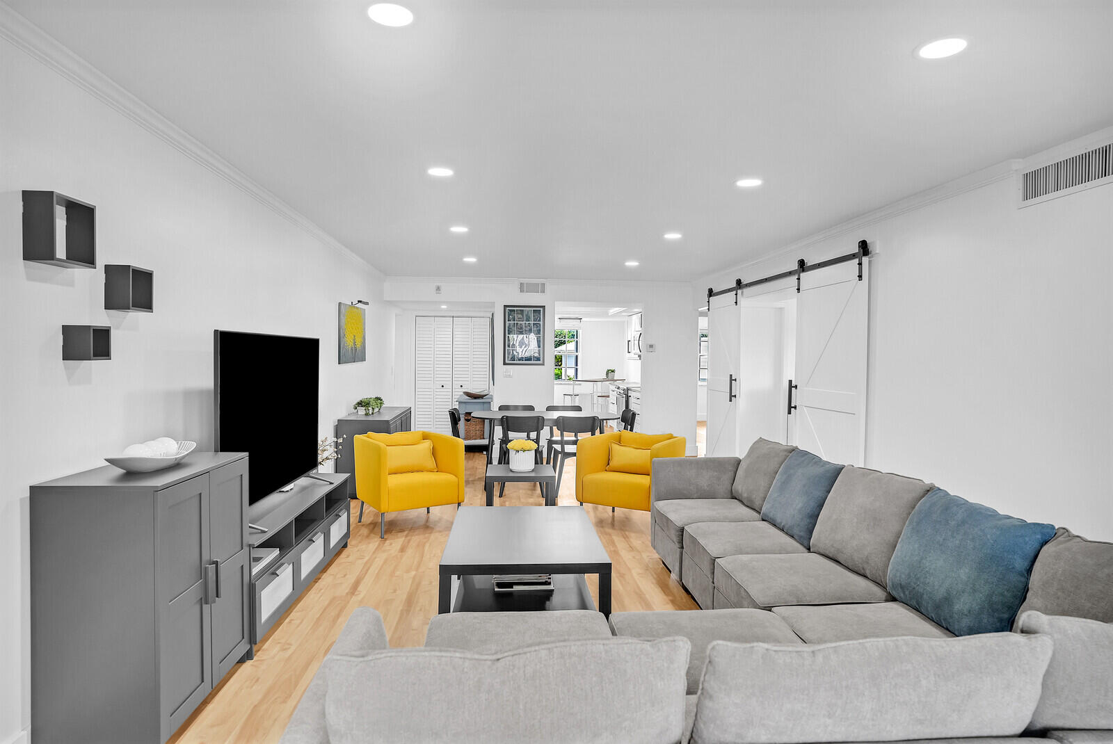 1210 Sugar Sands Boulevard, Unit 243 Singer Island, FL 33404 - Photo 11 of 55 a living room with furniture and a flat screen tv