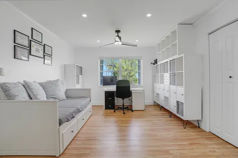 a bedroom with a bed and a couch