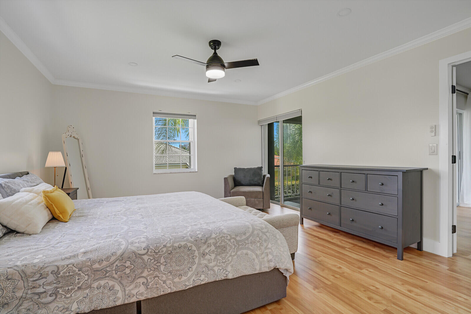 1210 Sugar Sands Boulevard, Unit 243 Singer Island, FL 33404 - Photo 30 of 55 a bedroom with a bed and wooden floor