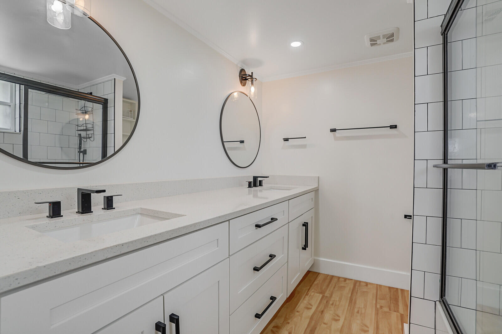 1210 Sugar Sands Boulevard, Unit 243 Singer Island, FL 33404 - Photo 32 of 55 a bathroom with a double vanity sink and a mirror