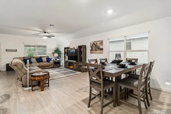 a view of a dining room with furniture and a livingroom