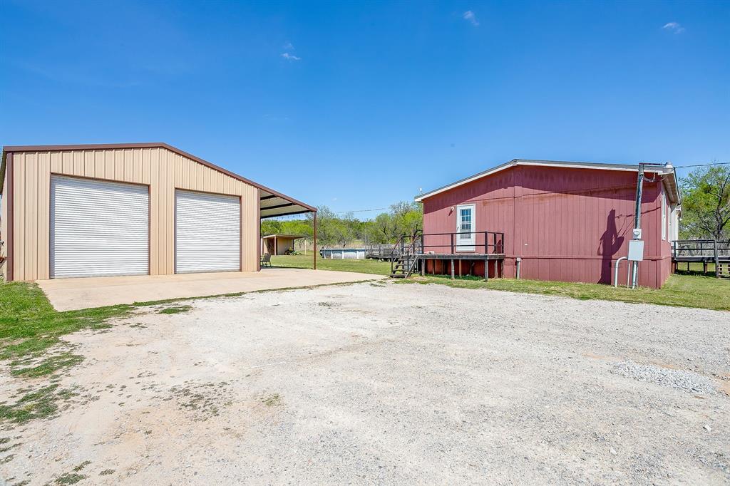 321 Young Road Millsap, TX 76066 - Photo 2 of 28 a view of a house with a backyard