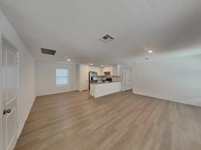 a view of a refrigerator and window