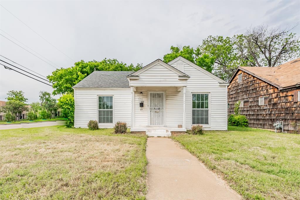 501 Colvin Street Fort Worth, TX 76104 - Photo 1 of 1 a front view of a house with a yard and garage