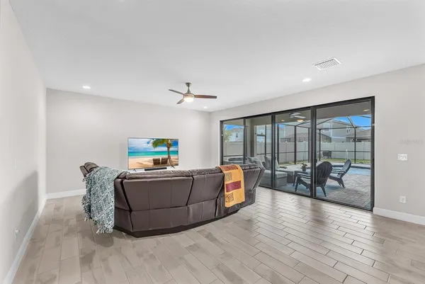 a living room with furniture and a rug