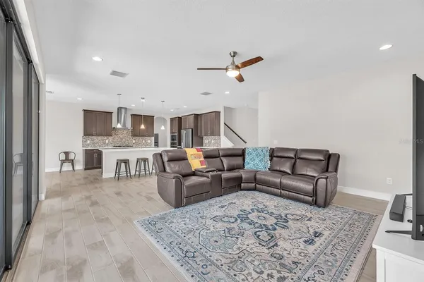 a large kitchen with a table and chairs in it