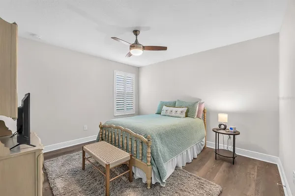 a bathroom with a granite countertop sink a large mirror and vanity