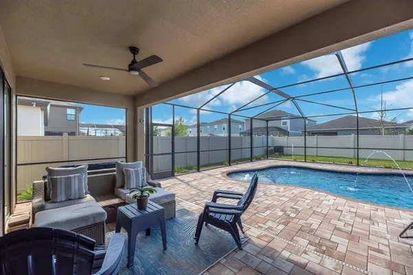 a view of a backyard with sitting area