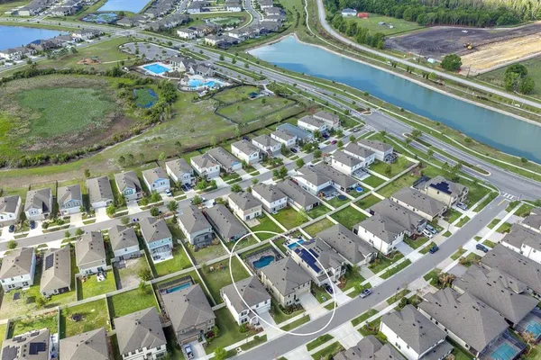a view of a swimming pool with a yard