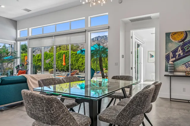 a bedroom with a bed and a potted plant