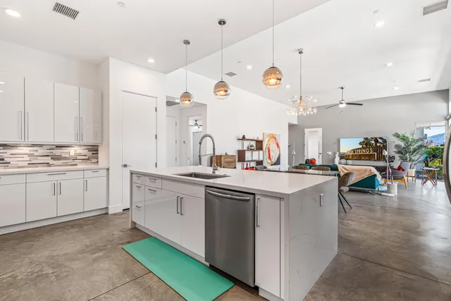 a bedroom with a bed a table and chair