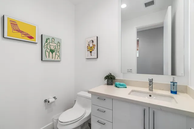 a bedroom with a bed and dresser