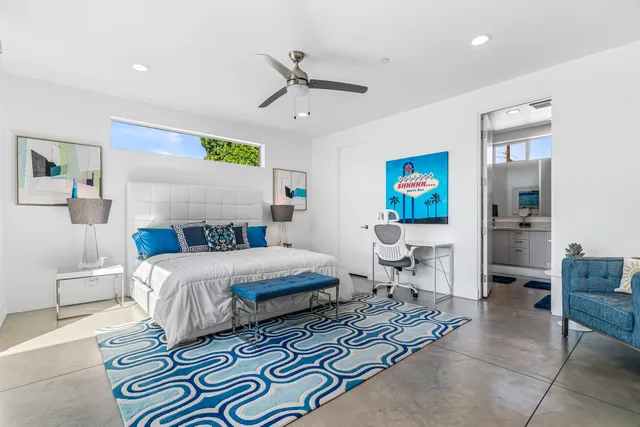 a bed room with a bed and a couch