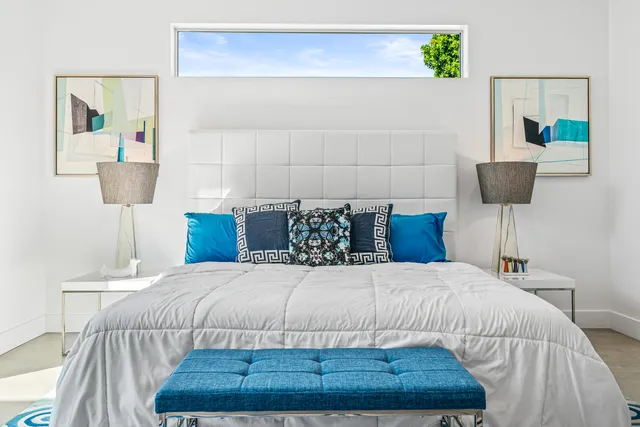 a bedroom with a bed and a couch