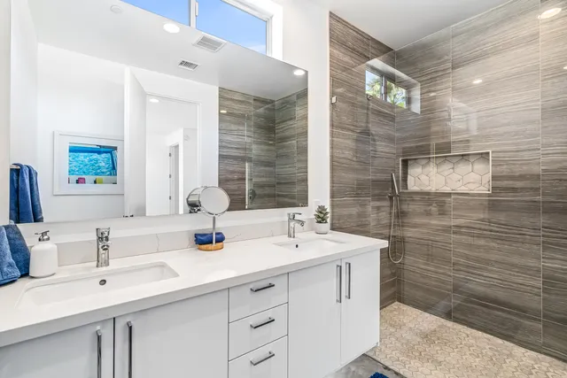 a bedroom with a bed a table and chairs