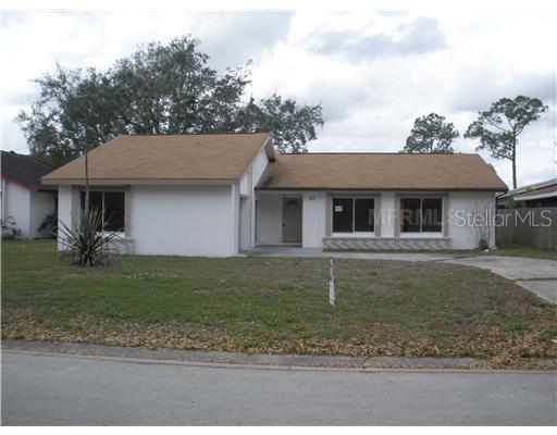 41 Chip Court Kissimmee, FL 34759 - Photo 1 of 1 a front view of a house with a yard