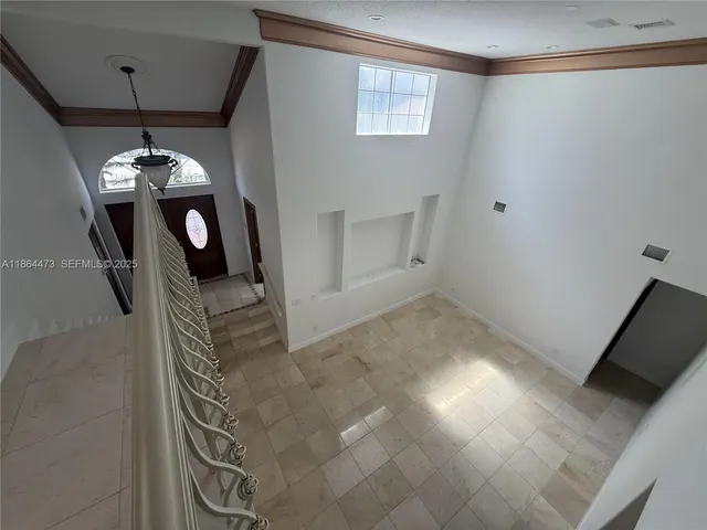 a kitchen with stainless steel appliances granite countertop a stove and a refrigerator