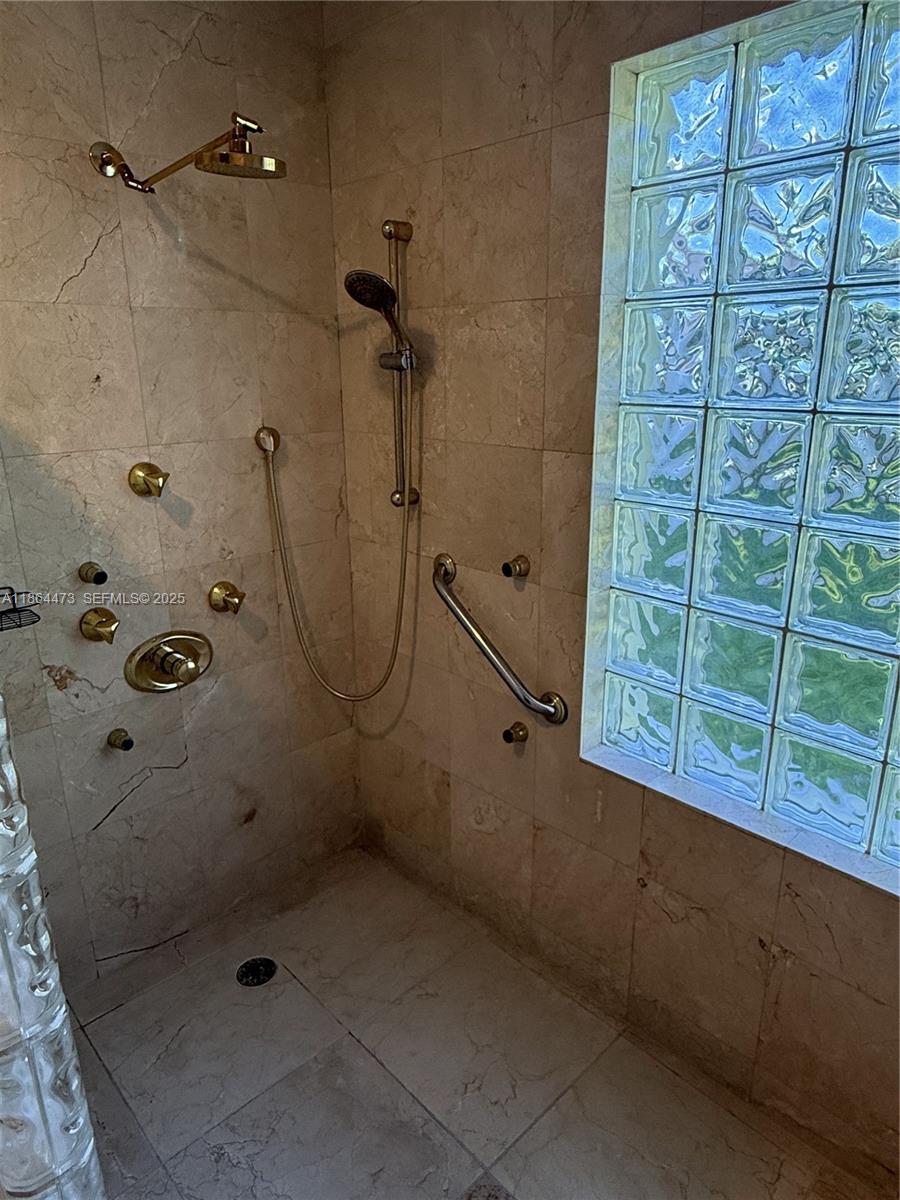 15051 Southwest 149th Street Miami, FL 33196 - Photo 16 of 20 a bathroom with a shower