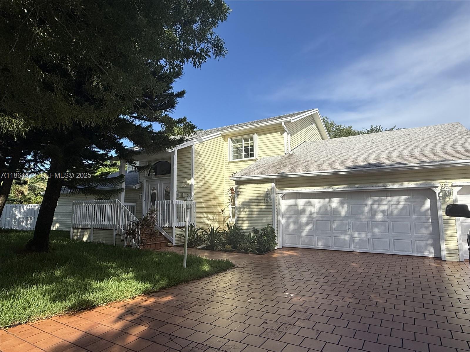 15051 Southwest 149th Street Miami, FL 33196 - Photo 2 of 20 a view of a house with a yard