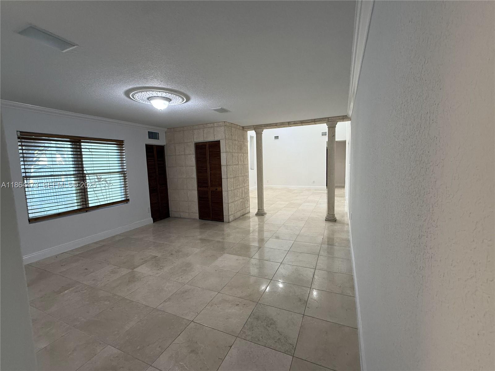 15051 Southwest 149th Street Miami, FL 33196 - Photo 10 of 20 a view of an empty room with a window